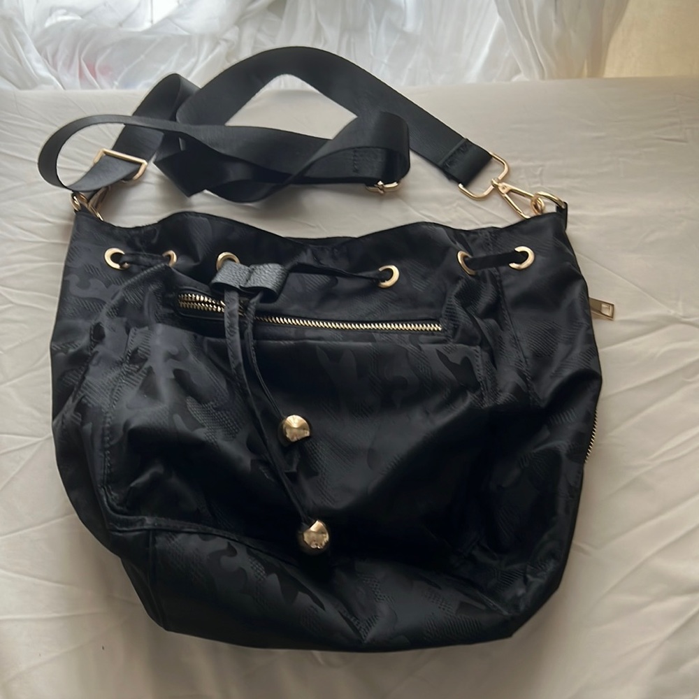 Never used purse. The Blake bag in black cameo